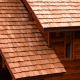 Close Up View of cedar shake roof installation for new construction residential cabin home